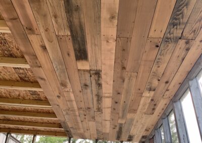 A close up of cedar boards in a sunroom.